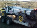 Off road buggy arriving on trailer